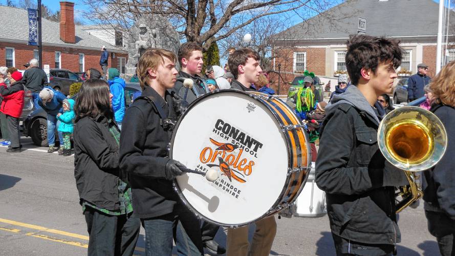 The marching band from Conant High School marches in the St. Patrick’s Day Parade.