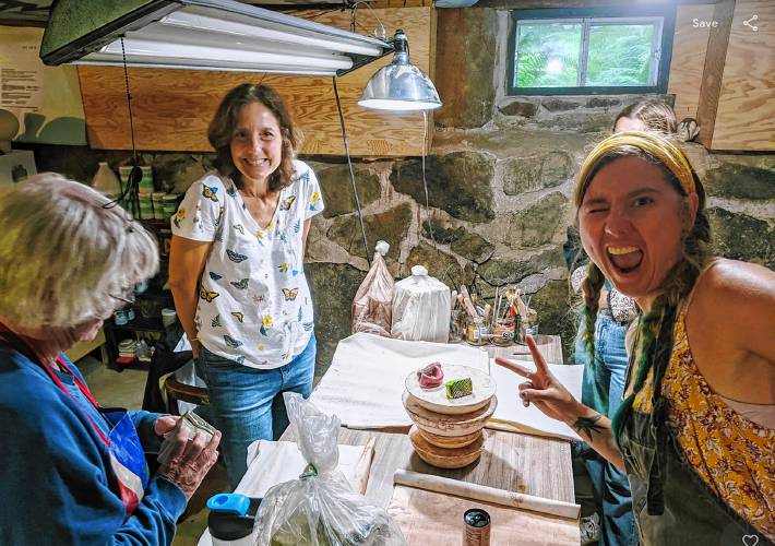 From left: ceramics instructor Kerry Mitschmeyer, left (looking down), Judy Driscoll, and Bess Haire when the Dublin Ceramics Center was in the basement of Kimberly Kersey Asbury’s house. 