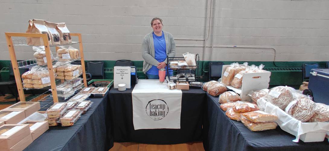 Vendor Stephanie Woods of Teacup Baking displays a variety of baked goods.