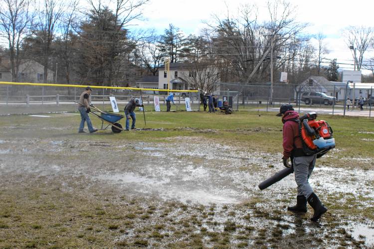 Mt. Monadnock Little League volunteers help to clean up the ball field at Memorial Park in New Ipswich, as part of April's town-wide cleanup, and in anticipation of the spring season.