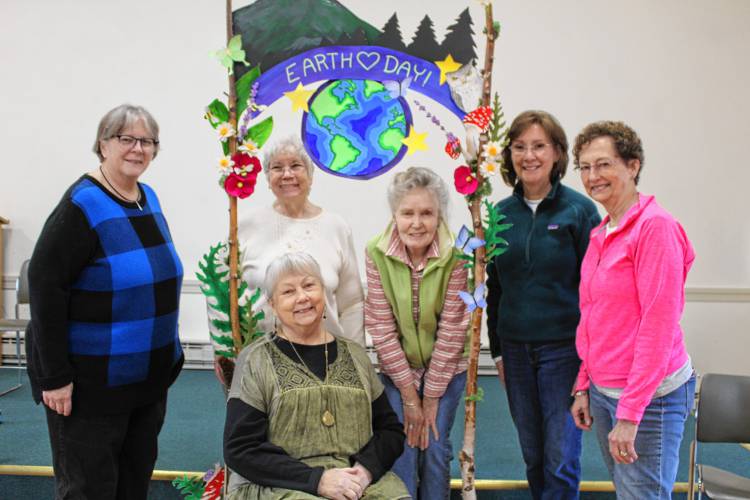Jaffrey Woman’s Club members Cathy Mills, Susan Petterson (sitting) Pauline Johansen, Ellen Clarke, Rody Navickis and Sue Sturges hold Earth Day activities in the club hall on Main Street Saturday.