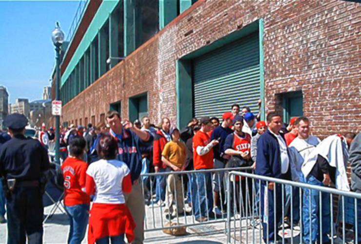 Fans wait outside Fenway Park for a 2004 game against the New York Yankees. It was in 2004 that the Red Sox broke the “Curse of the Bambino” by winning the World Series after coming back from a 3-0 deficit against the Yankees in the playoffs.
