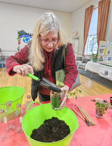 June Fulton creates a terrarium in a Mason jar.