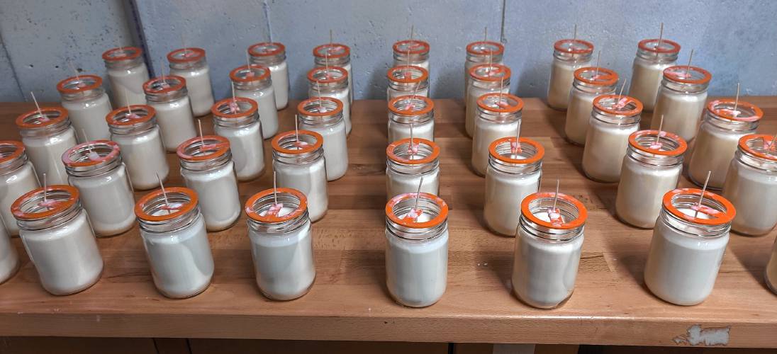Full-size glass jars await labels.