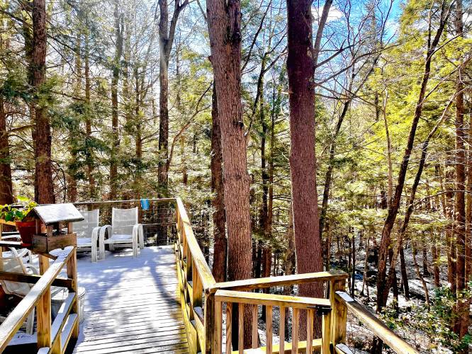 The treehouse-style deck over the brook. 