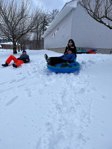 Audrey, Bobby and Donovan Griffis tubing at Highbridge Hill Elementary School 