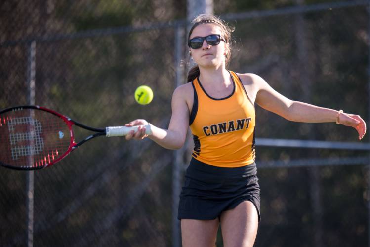 Conant's Caroline Rockhill gets a shot against Kearsarge during Tuesday's match. 