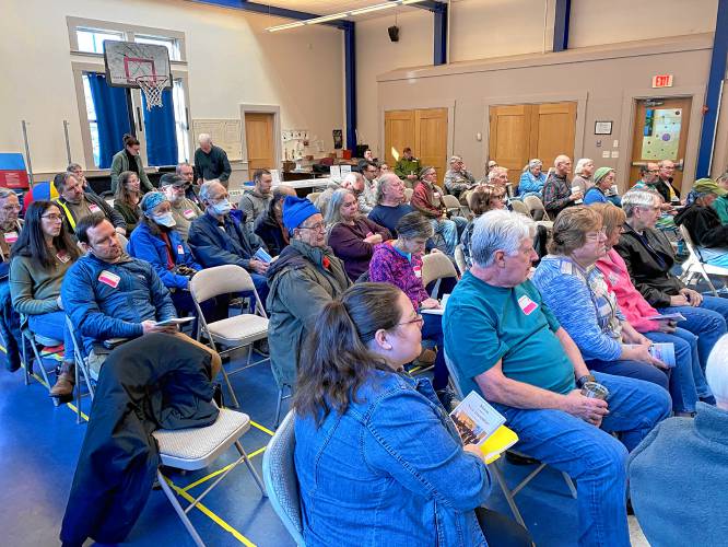 Residents gather at Mason Elementary School for Town Meeting.