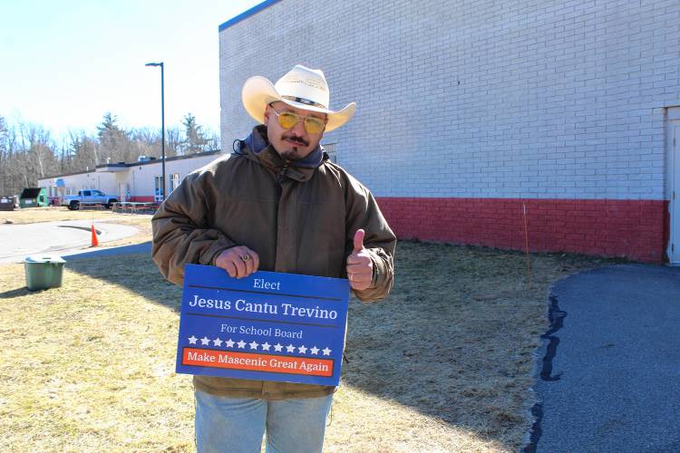 Jesus Cantu Trevino campaigns outside of the Mascenic Regional High School during voting.