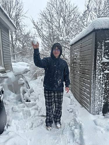 Gabe Hinkel, 17, of Greenville throws a snowball.