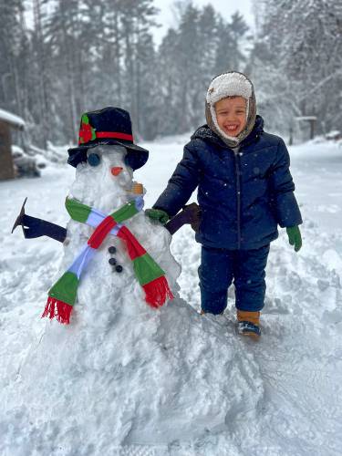 Ryder Beauregard and his snowman in Jaffrey.