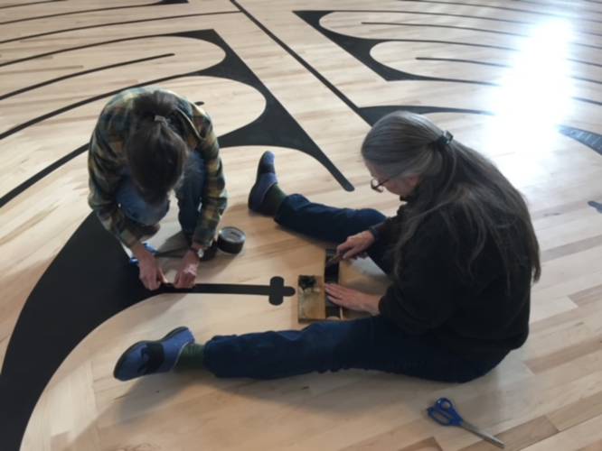 Taping the center of the labyrinth.