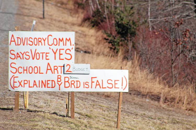 A sign on the side of Turnpike Road advocates for petition articles on the ballot, none of which gained community support.