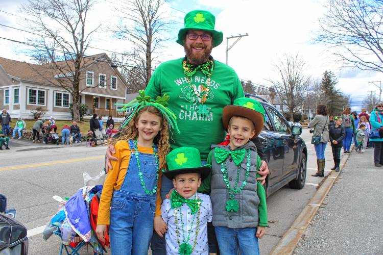 Chris Cole of Hinsdale and his children, Rylleigh, Eli and Griffin come in their best green accessories to watch the parade.