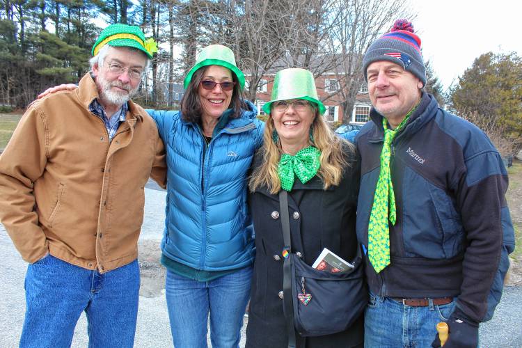 Peter Leishman, Cheryl Seifert, Stephanie Hurley and Bob Bolt don festive ties and hats in St. Patrick’s Day green while watching the parade.