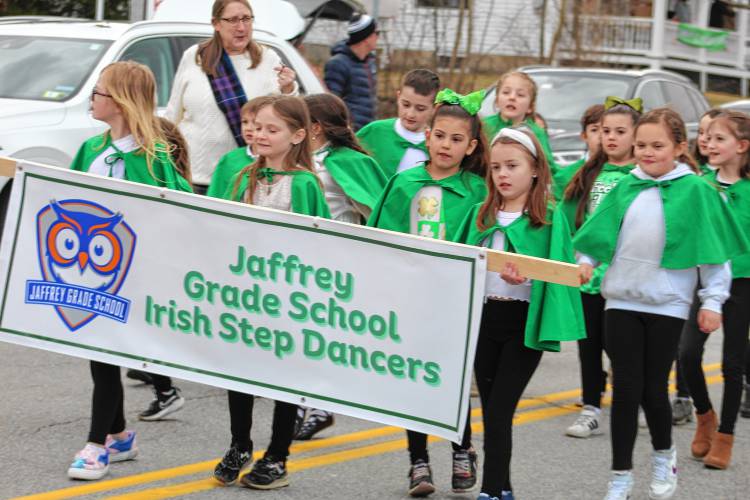 The Jaffrey Grade School Irish Step Dancers do a jig while making their way down Main Street.