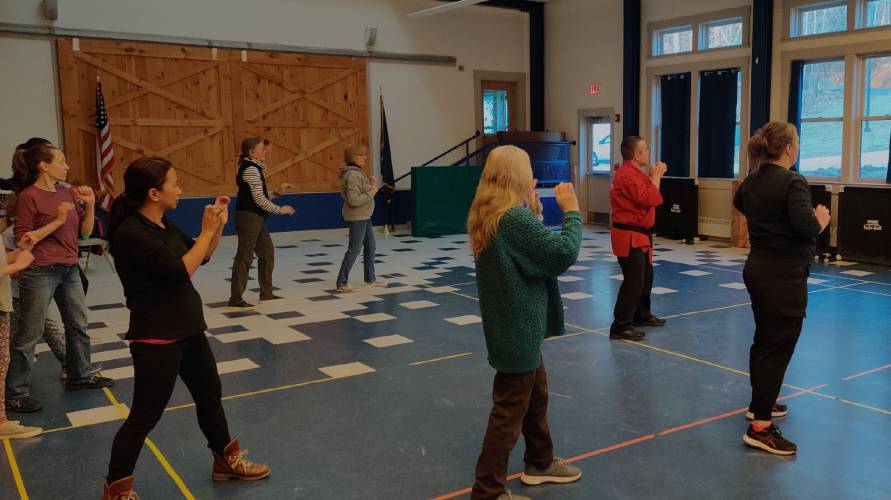 Bedford Martial Arts Academy owner and instructor John Stewart teaches a women’s self-defense course at the Mason Elementary School on Thursday.
