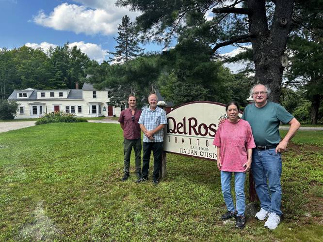 New Del Rossi’s owners Wayne Asbury and Bill O’Mahony (left) pictured at the entrance of the restaurant with previous owners Elaina and David Del Rossi.