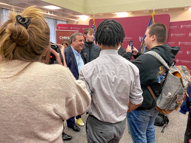 Former New Jersey Gov. Chris Christie poses for photos after speaking at Franklin Pierce University’s “Pizza and Politics” Thursday.