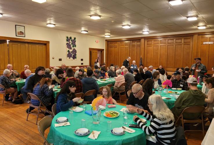 Community members gather at the Antrim Presbyterian Church Fellowship Hall for The Grapevine and Avenue A’s volunteer celebration.