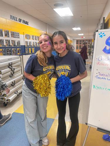 Riley Heider, left, and Nora Eliopolios work in the Class of 2026 lunch booth. 