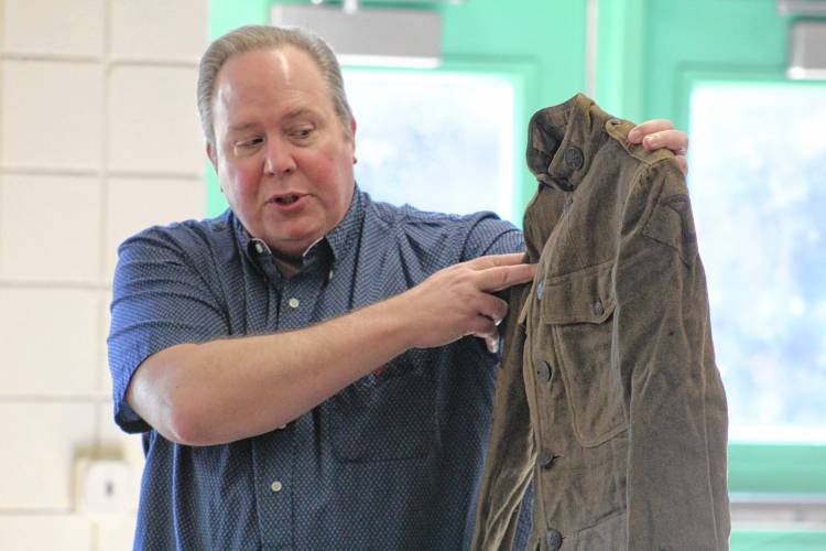 Scott Kraska, owner of the New Ipswich Museum of History, explains the meanings behind various insignia on a World War I uniform.