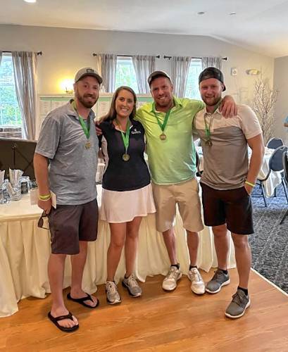 Tournament winners, from left, Tim Wholey, Travis Spaulding and Keith Fait, pictured with tournament director LeeAnn Moore.