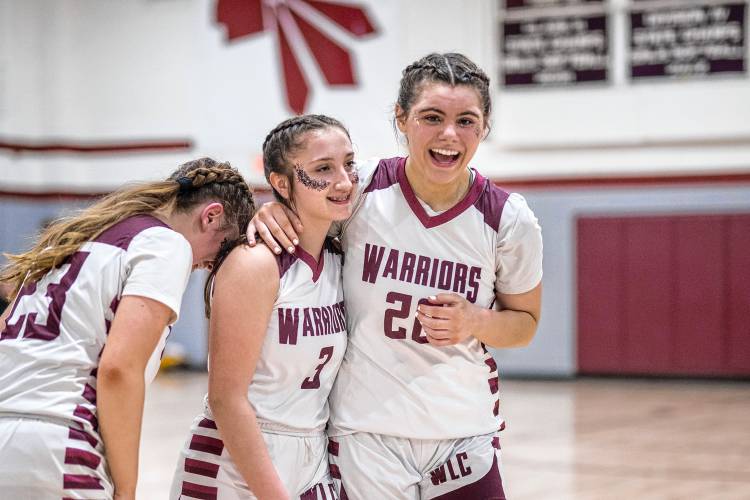 WLC's Kelsey Crouse, left, Haidyn Paquette and Adri Bausha celebrate their win.