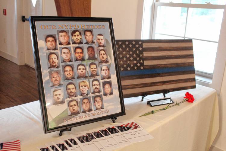 Displays with photosgraphs show New York City police officers who died during the Sept. 11 attacks.