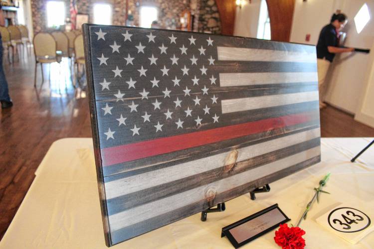 A flag with a red stripe commorates firefighters lost during the Sept. 11 terrorist attacks.