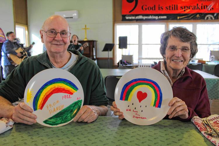 Carl and Marge Shepardson of Marlborough came prepared to the Jaffrey Earth Day kickoff no-waste potluck by bringing their own plates, decorated years ago by their children.