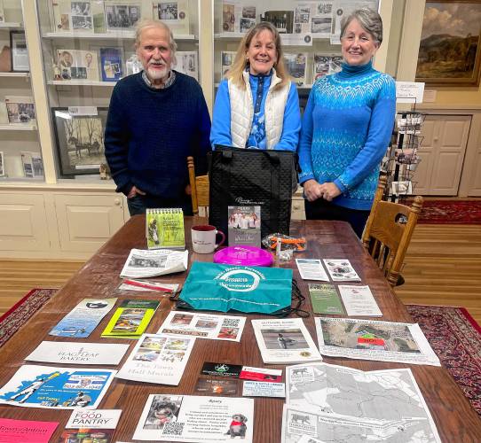 Gordon Allen (left), Jennifer Adams (middle) and Helene Newbold display one of the Antrim Community Board’s welcome bags. 