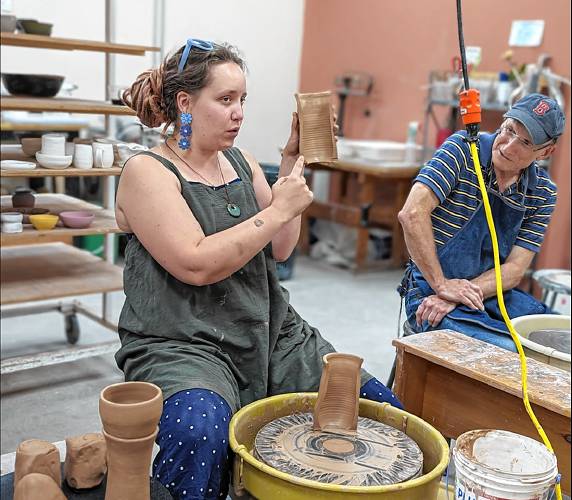 Instructor Lauren Morrocco, head of the NH Potters’ Guild, on a wheel at the Dublin Ceramics Center. 