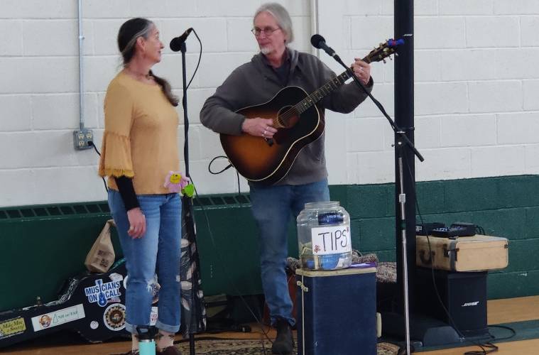 Susan Lang (left) and David Young of the band Eyes of Age provide musical entertainment.
