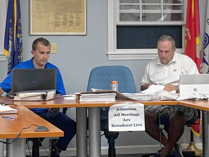 New Ipswich Zoning Board member Walker Farrey and David Lage deliberate during a public hearing on Thursday.