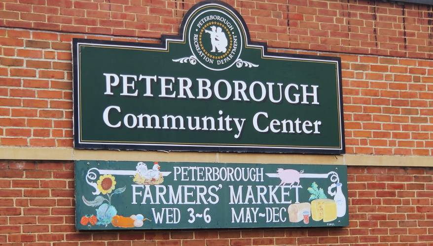 The sign advertising the farmers’ market outside the Peterborough Community Center.