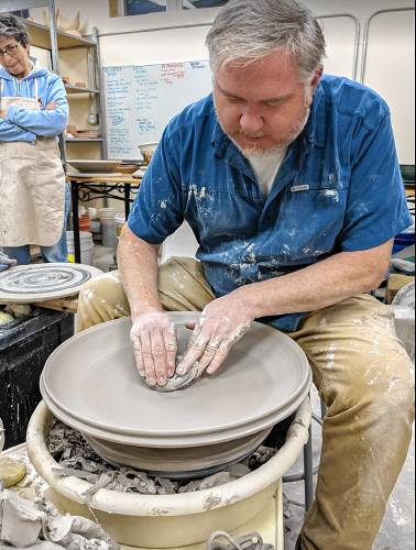 Instructor Chris Archer demonstrates a wheel during a workshop at the Dublin Ceramics Studio. 