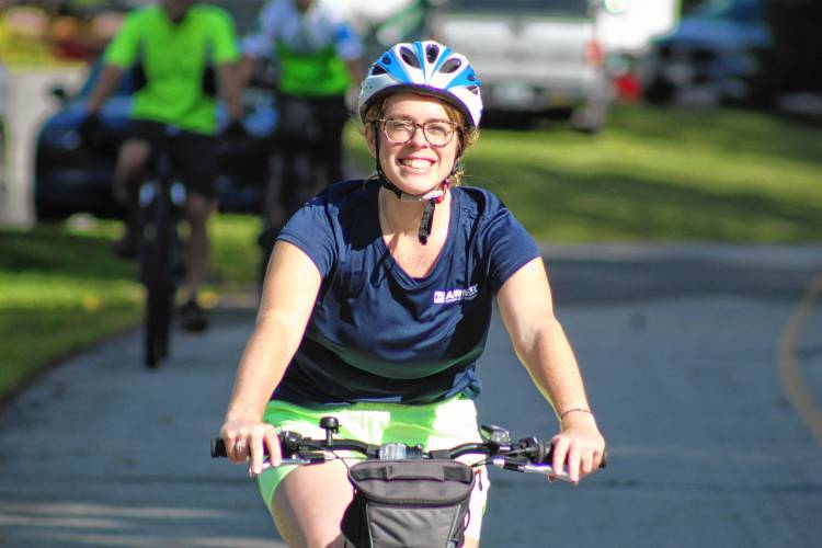 Lauren Grayson of Merrimack rides as part of the contingent of Airmar Techogies employees, one of the sponsors of the event.