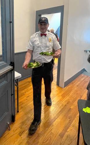 Francestown Fire Chief Larry Kullgren serves salads. 