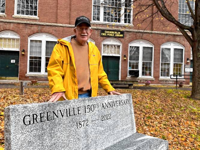 Richard Miller with a bench celebrating the town’s 150th anniversary, installed in front of Greenville Town Hall as part of ongoing beautification efforts downtown.