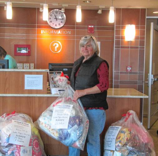 Robyn Manley delivers blankets to Lakes Region General Hospital, before there was a Lakes Region Project Linus chapter.