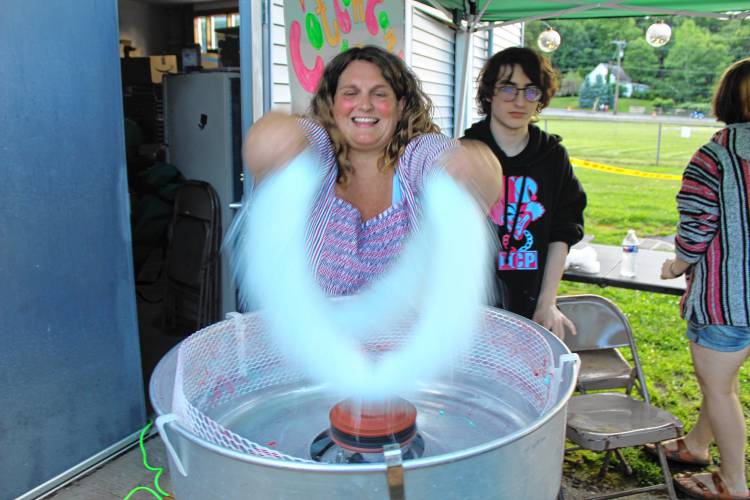 Heather Schoff makes cotton candy during Greenville’s Independence Day celebrations at Memorial Field on Monday.