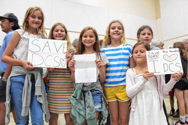 Dublin middle and elementary schoolers Emma Garnham, Mila Boutelle, Isla Higley, Annika Jackson, Cora Higley and Lily Marcum advocate for keeping Dublin Consolidated School open during a reconfiguration forum on Wednesday.