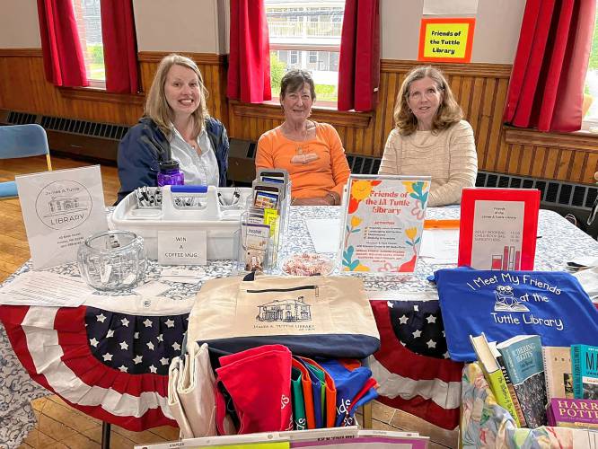 Cynthia Jewett, director of Antrim’s Tuttle Library, left, with  Friends of the Library volunteers Cynthia Riordan and Nancy Langrall at the Antrim Community Fair. 