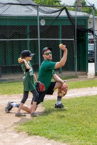 Nick Hill teaches Libby Mercier how to throw.