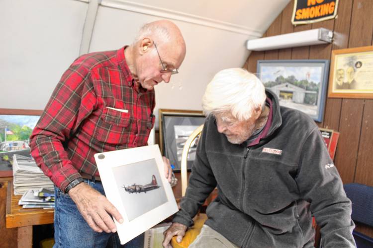 Harvey Sawyer and Bill Coleman discuss the airstrip’s history. 