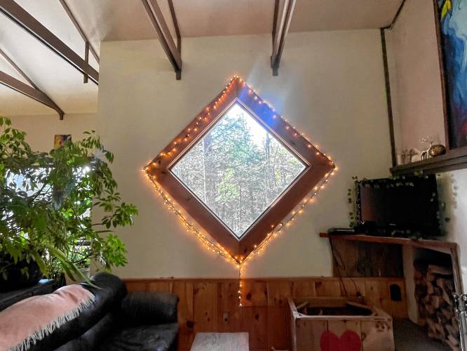 The Kalvaitis family added the diamond-shaped window in the den. 