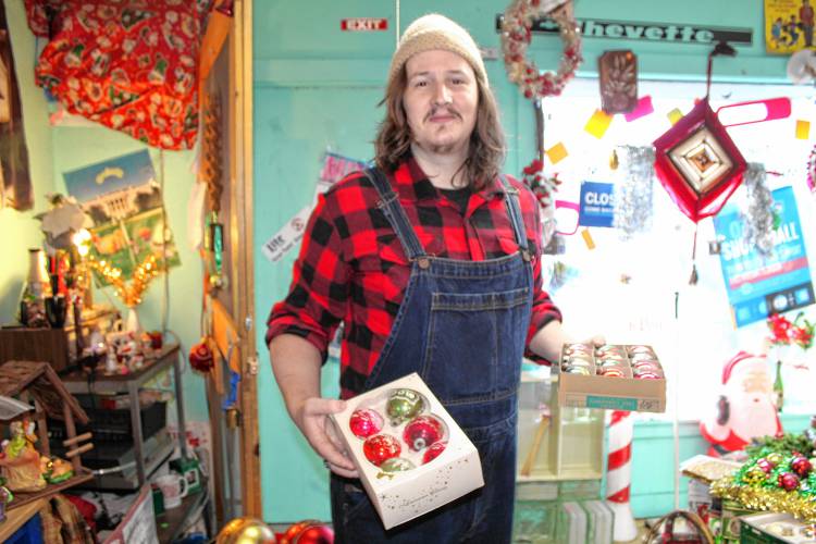 Samuel Geiger of Rindge shops for Christmas decorations at The Melamine Cup while wearing plaid, which got him a discount.