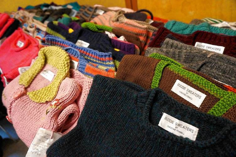 A display of Fennell’s handknit “Buddie” sweaters. 