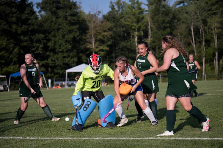 Mascenic junior Faith Wooster attacks Monadnock keeper Makayla Harwood during the fourth period of Tuesday's game. 